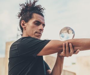A person performing a balancing exercise, showing focus and control.